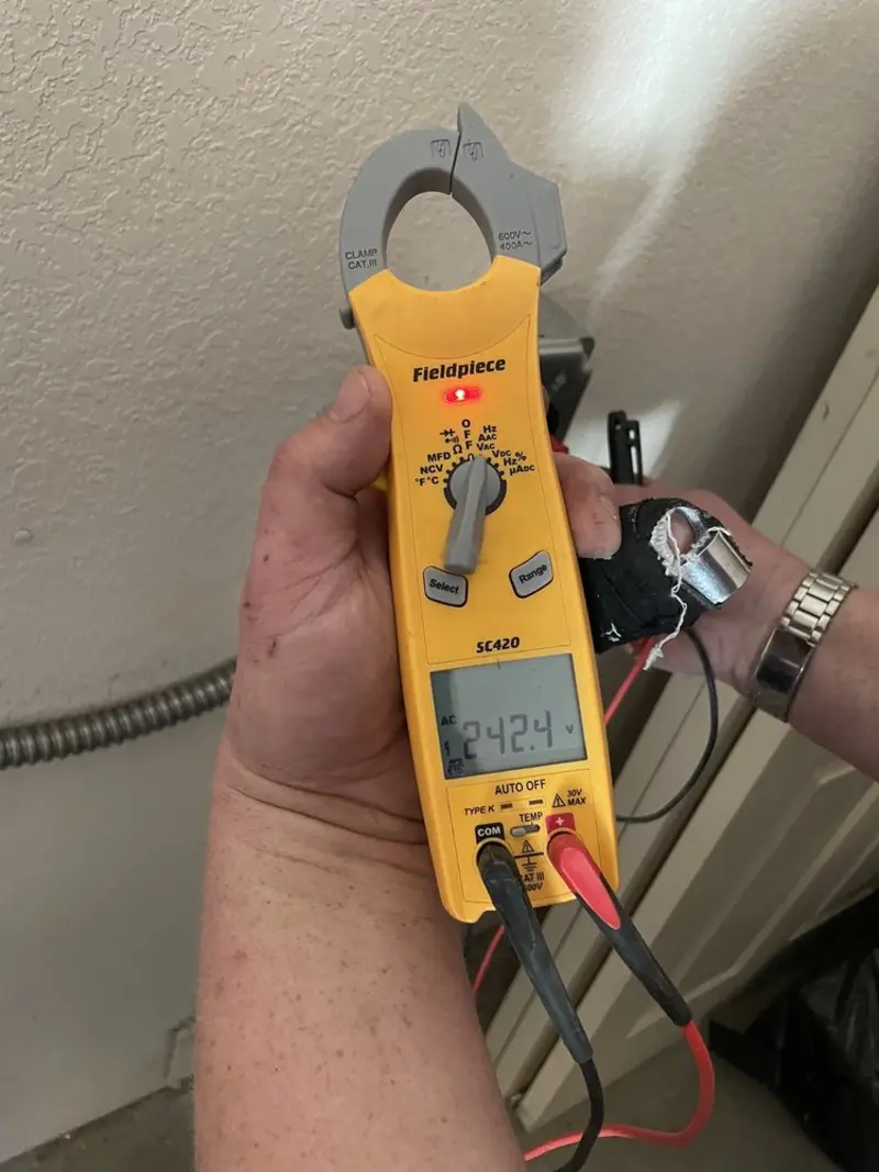Voltage testing with clamp meter during Outlet Installation in Coventry